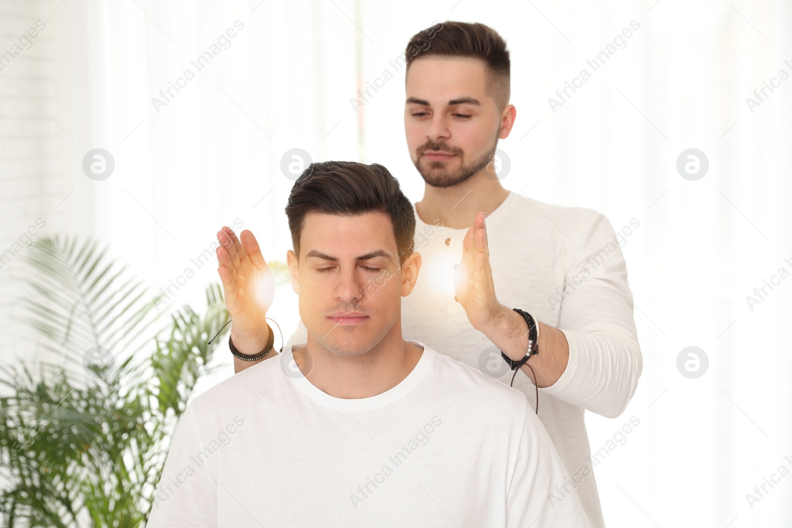 Photo of Man during healing session in therapy room