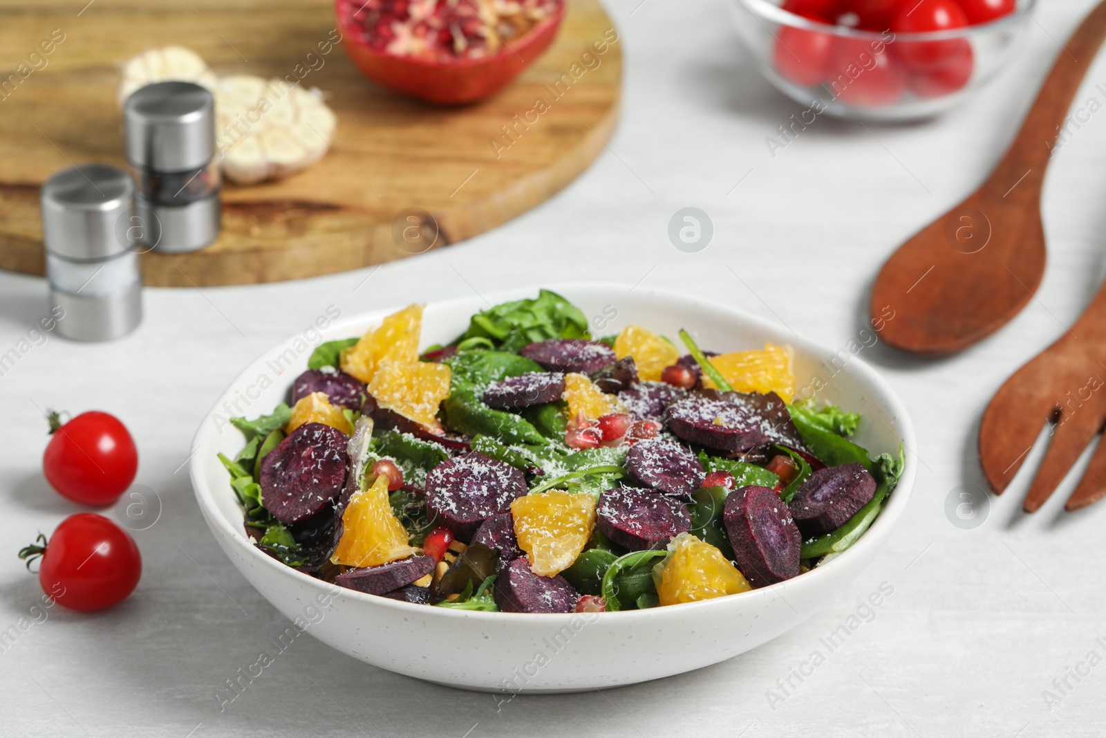 Photo of Delicious fresh carrot salad served on white table