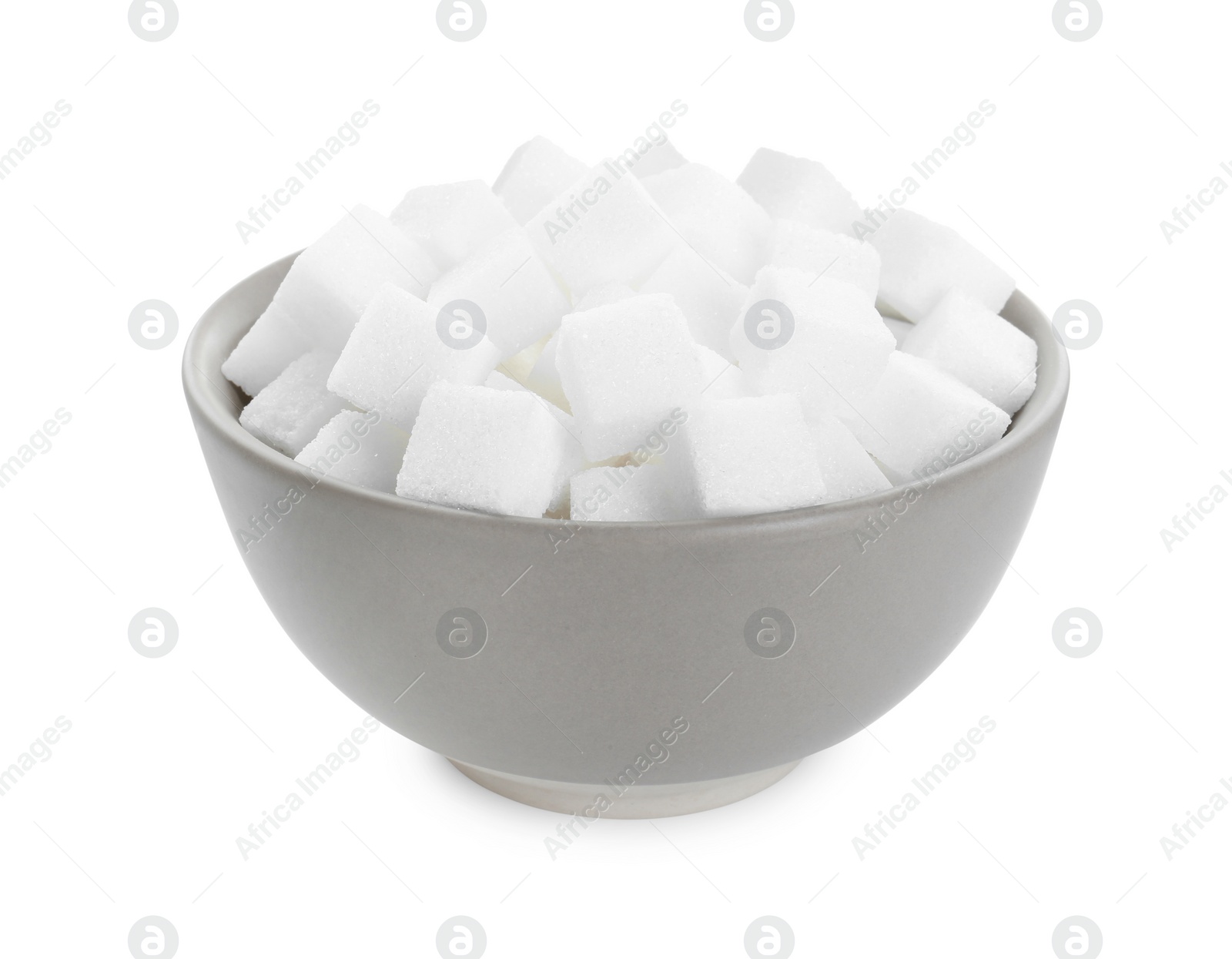 Photo of Sugar cubes in bowl isolated on white