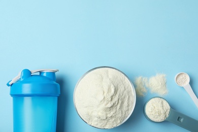 Photo of Flat lay composition with protein powder on color background. Space for text