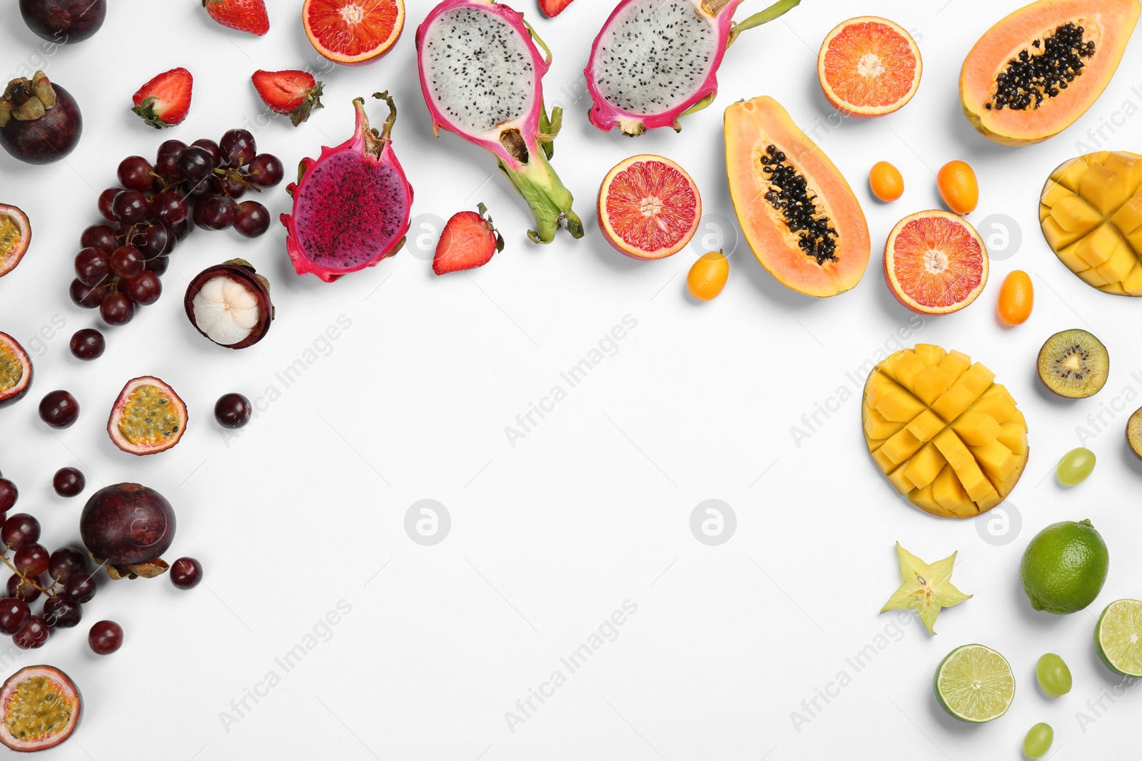 Photo of Many different delicious exotic fruits on white background, flat lay. Space for text