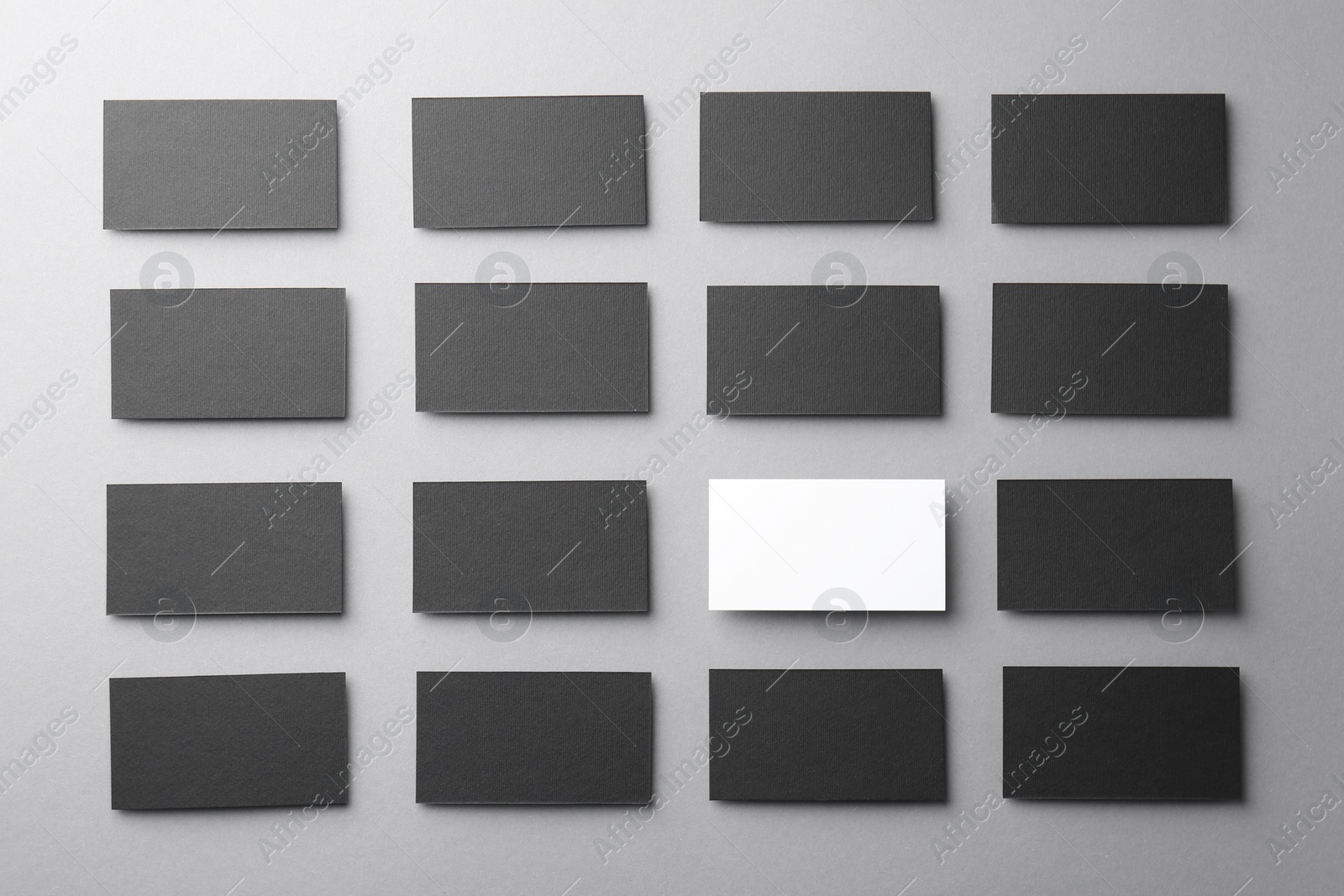 Photo of Blank business cards on light grey background, flat lay. Mockup for design