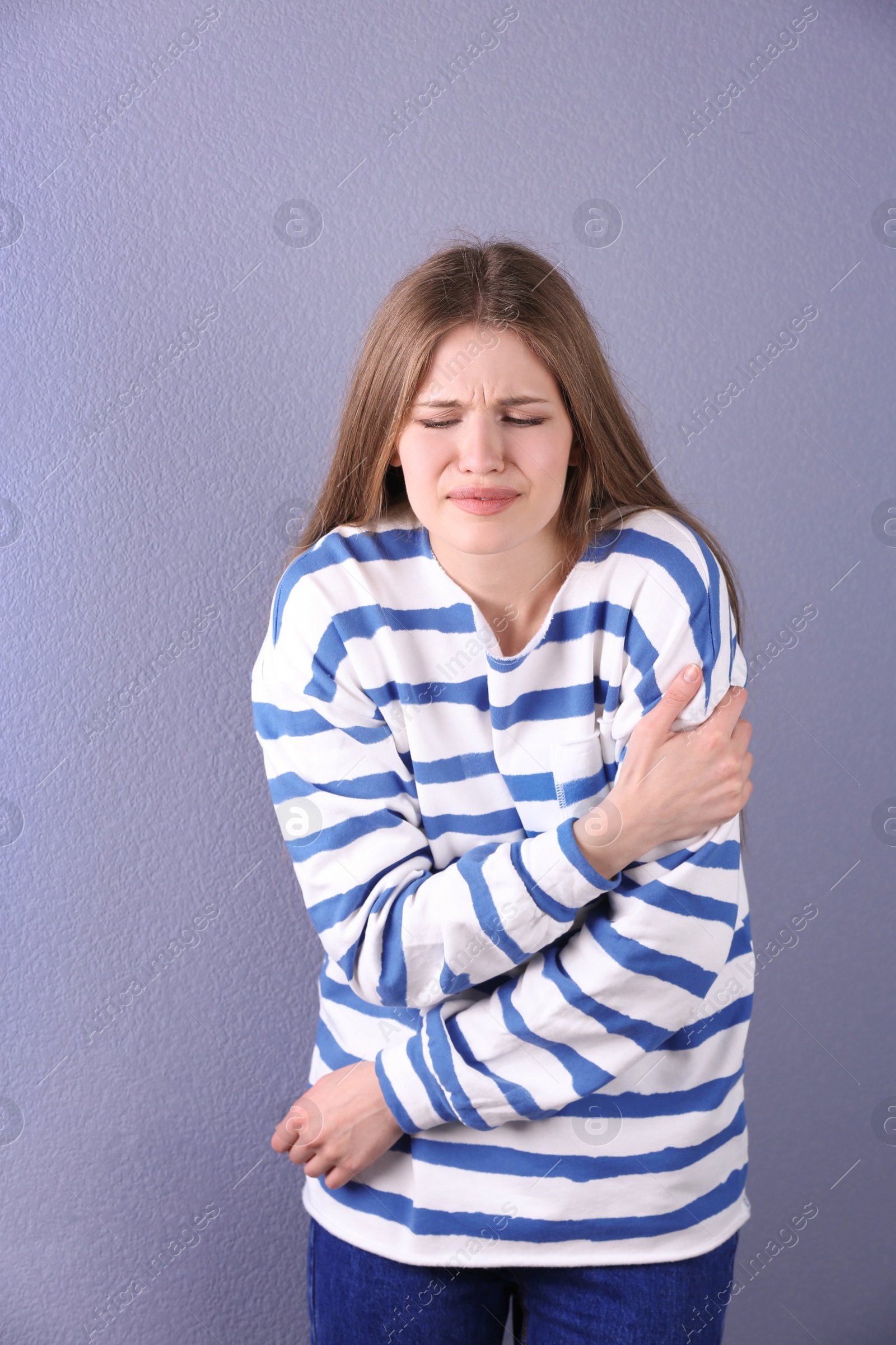 Photo of Young woman having heart attack on color background