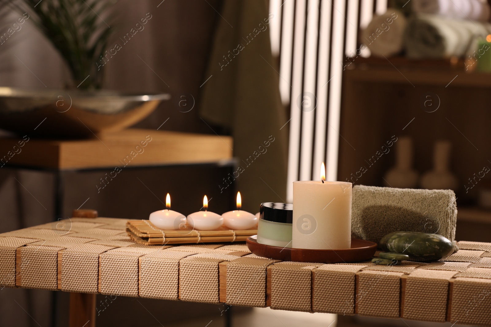 Photo of Beautiful composition with different spa products on wicker bench indoors