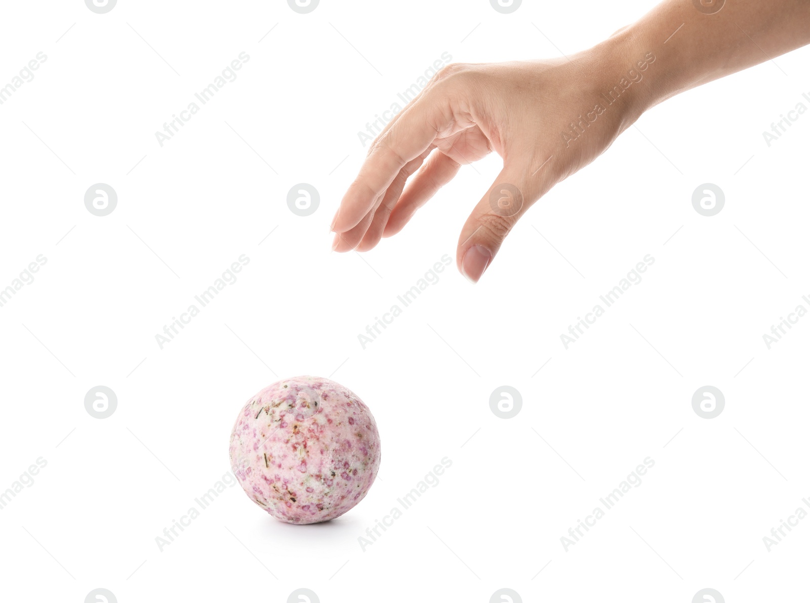 Photo of Woman reaching for bath bomb on white background, closeup