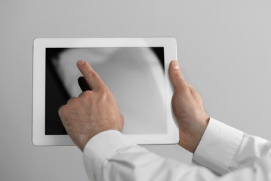 Closeup view of man using new tablet indoors