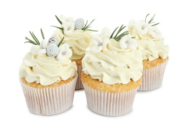 Photo of Tasty Easter cupcakes with vanilla cream isolated on white