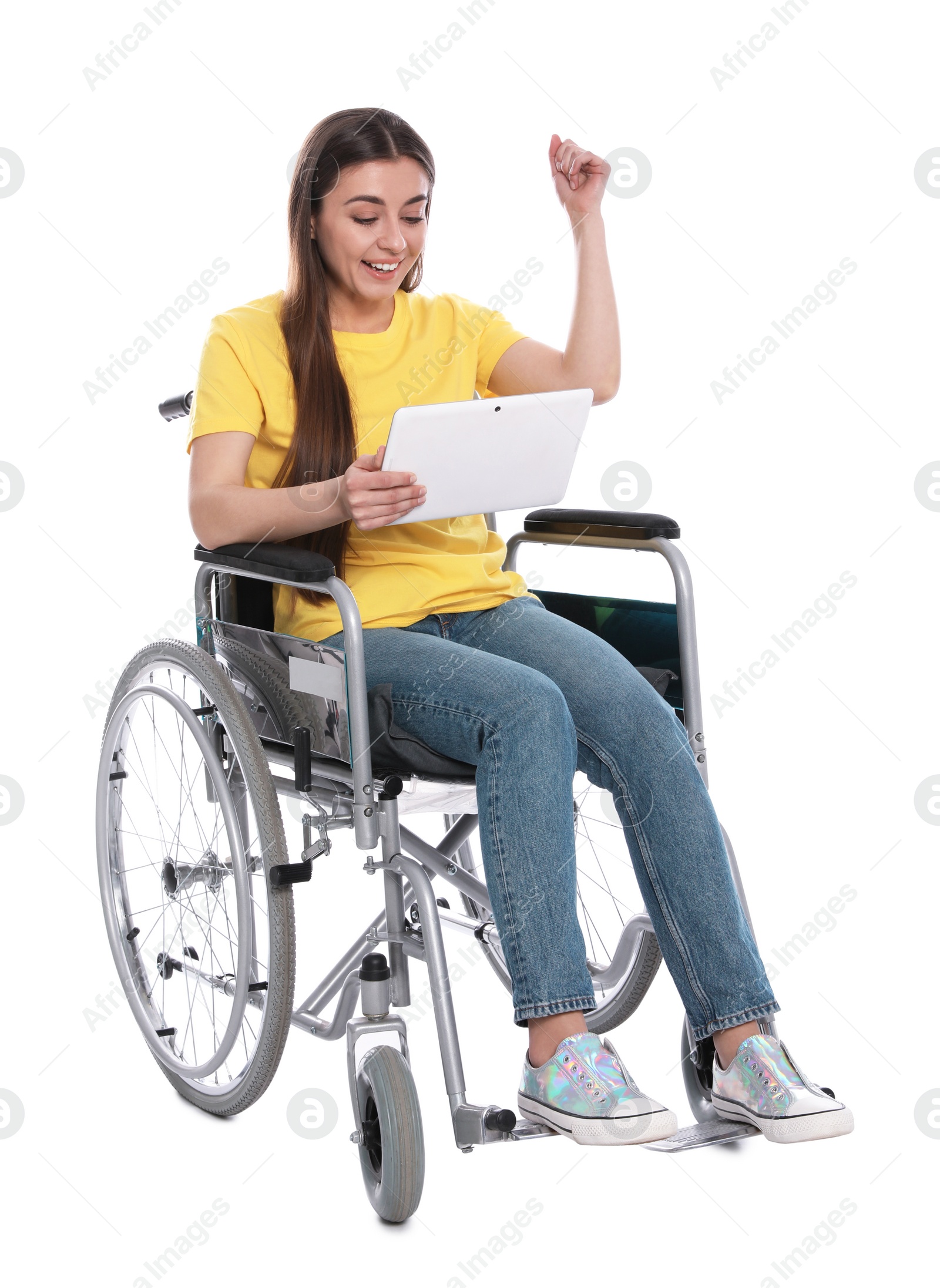 Photo of Happy young woman in wheelchair with tablet isolated on white
