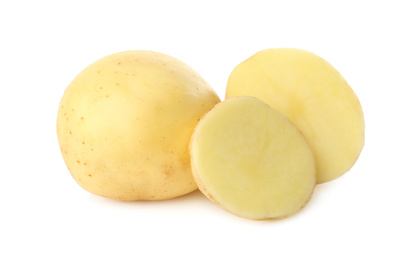 Photo of Whole and cut fresh raw organic potatoes on white background