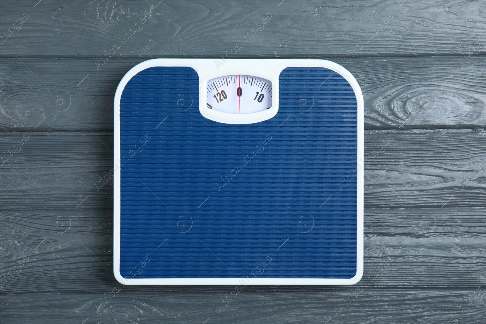 Photo of Scales on wooden background, top view. Weight loss