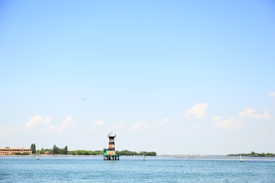 Photo of VENICE, ITALY - JUNE 13, 2019: Picturesque seascape with blue sky and coastline