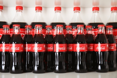 Photo of MYKOLAIV, UKRAINE - NOVEMBER 14, 2018: Many bottles of Coca-Cola on display in store