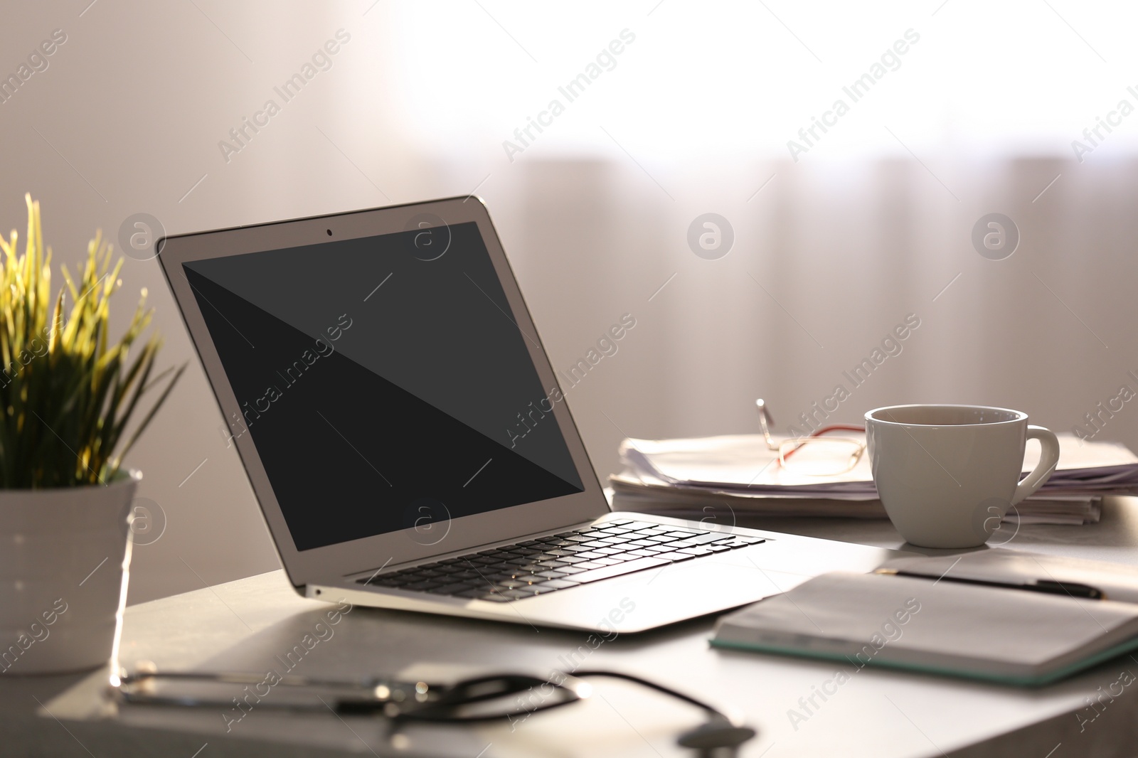 Image of Modern laptop on table indoors. Comfortable workplace 