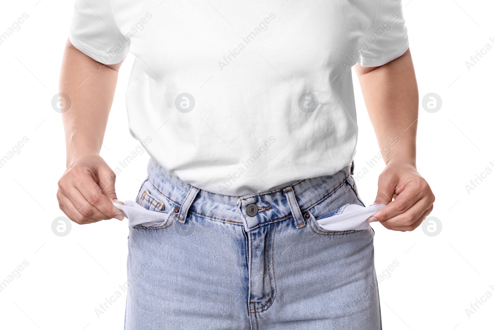 Photo of Poor woman showing empty pockets on white background, closeup