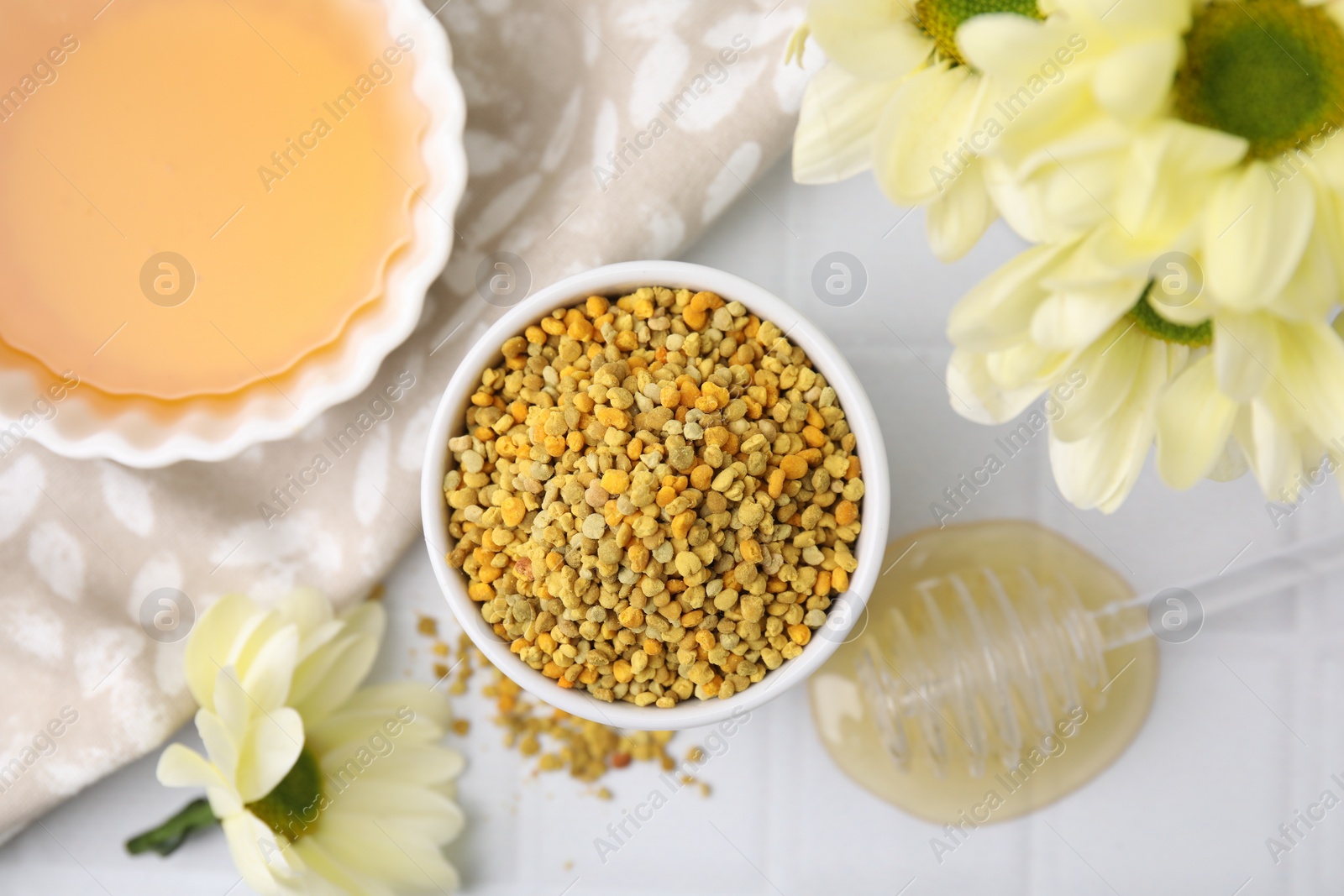 Photo of Flat lay composition with fresh bee pollen granules and honey on white table
