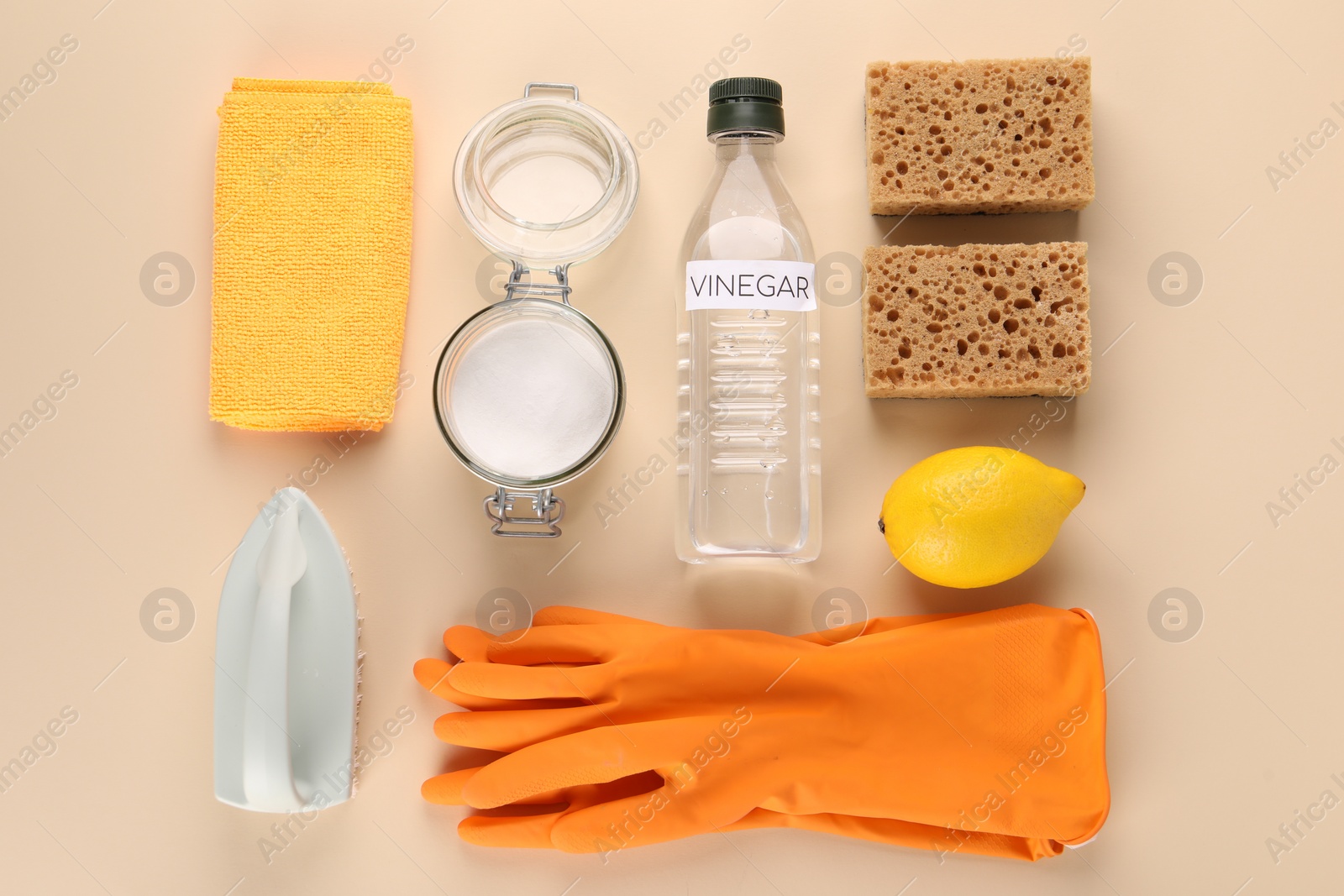 Photo of Eco friendly natural cleaners. Flat lay composition with bottle of vinegar on beige background