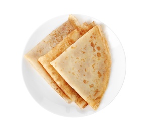 Photo of Tasty thin folded pancakes on plate against white background, top view