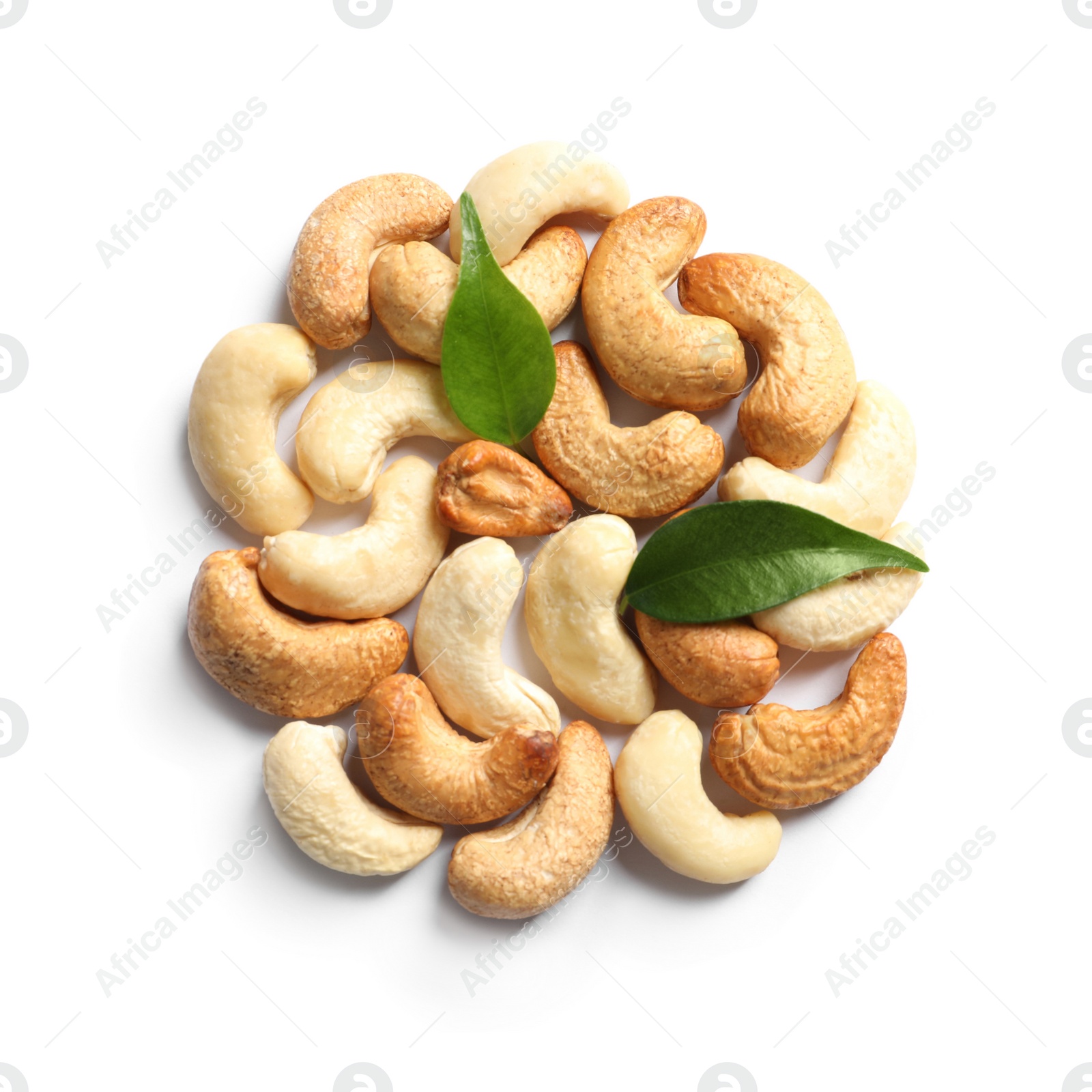 Photo of Tasty cashew nuts and leaves isolated on white, top view