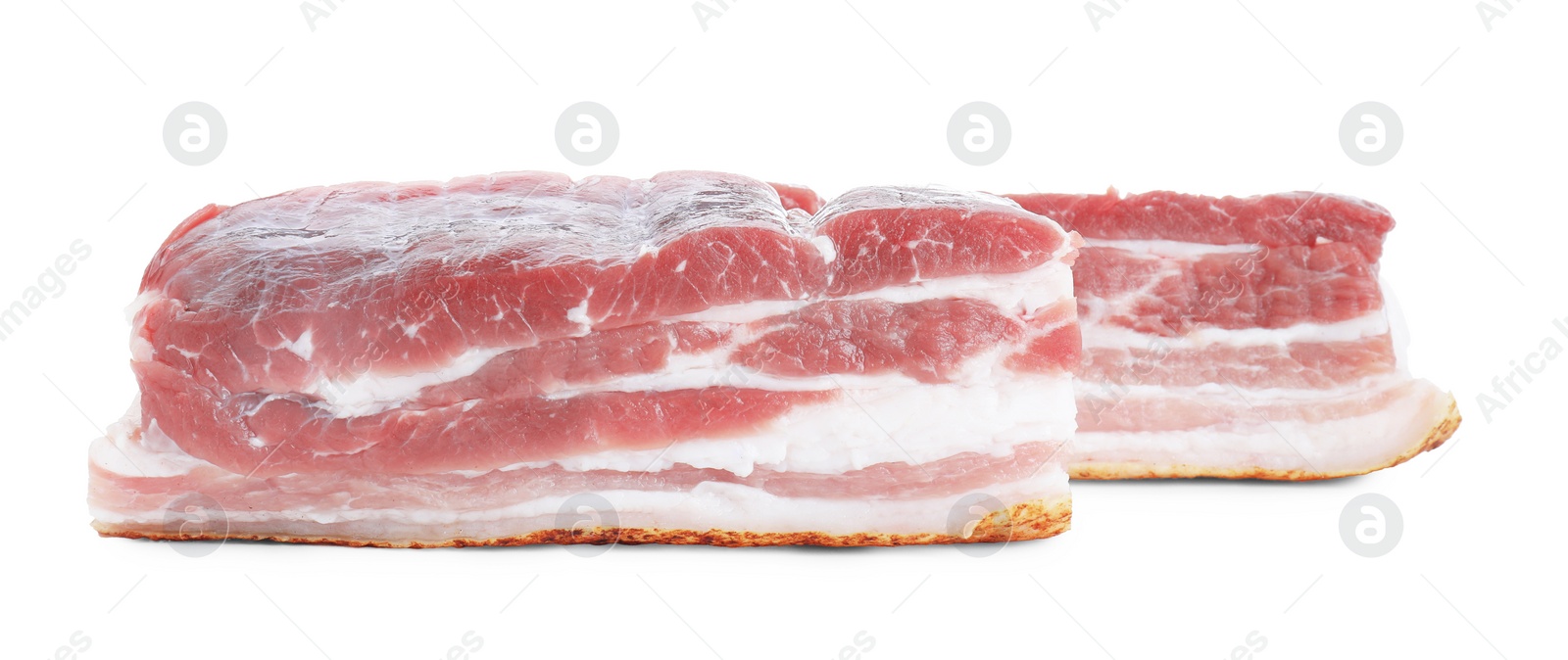 Photo of Pieces of raw pork belly isolated on white