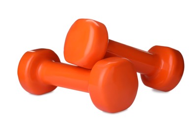 Photo of Orange dumbbells on white background. Weight training equipment