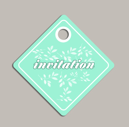 Wedding invitation tag with floral design on grey background, top view