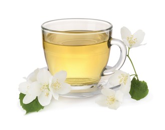 Photo of Aromatic herbal tea in glass cup and flowers isolated on white