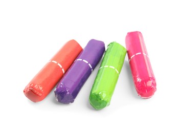 Photo of Colorful tampons on white background. Menstrual hygiene product