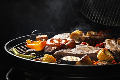 Assorted delicious meat and vegetables on barbecue grill