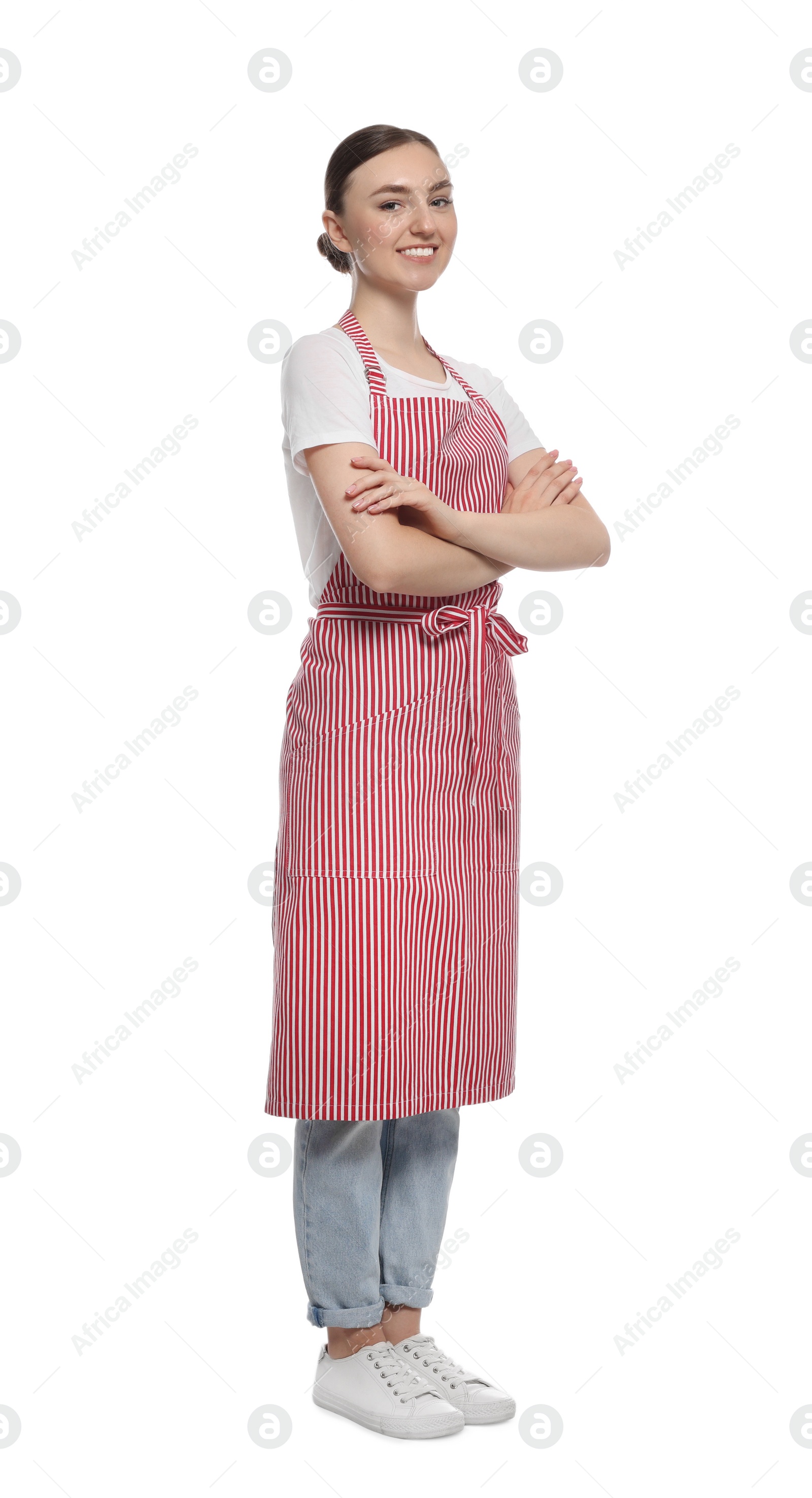 Photo of Beautiful young woman in clean striped apron on white background