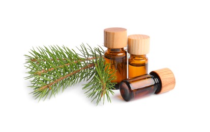 Photo of Bottles of pine essential oil on white background