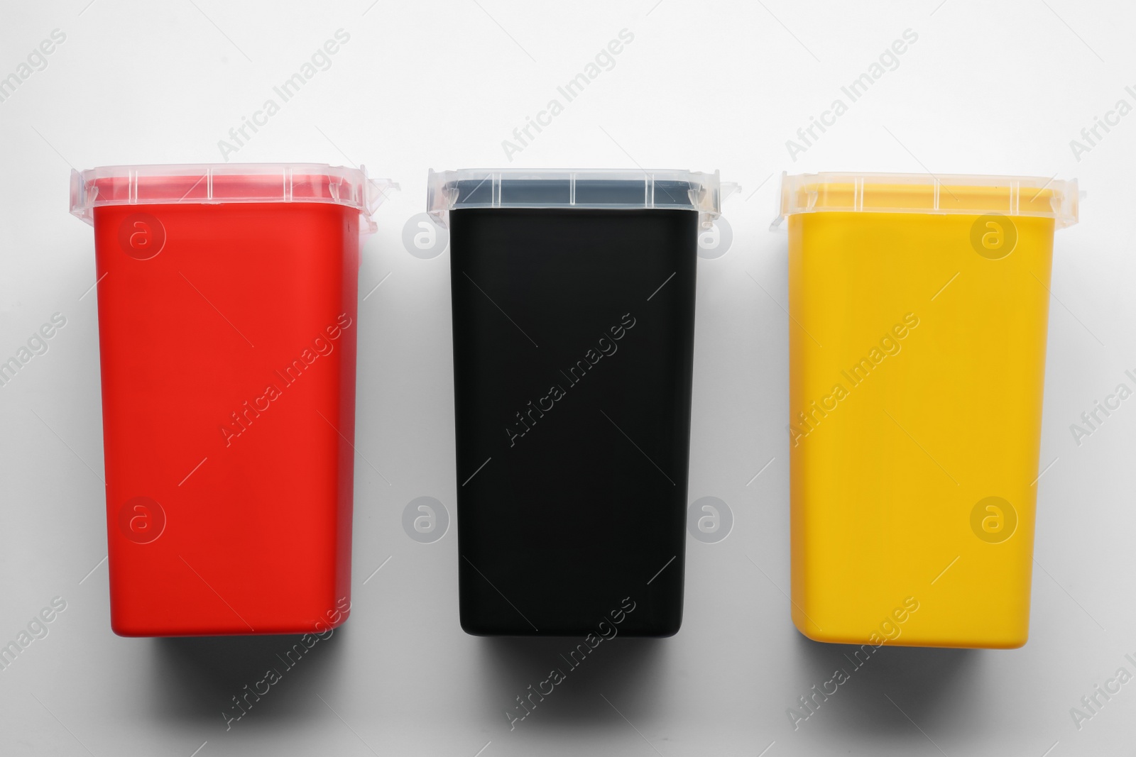 Photo of Sharps containers for used syringes on white background, top view