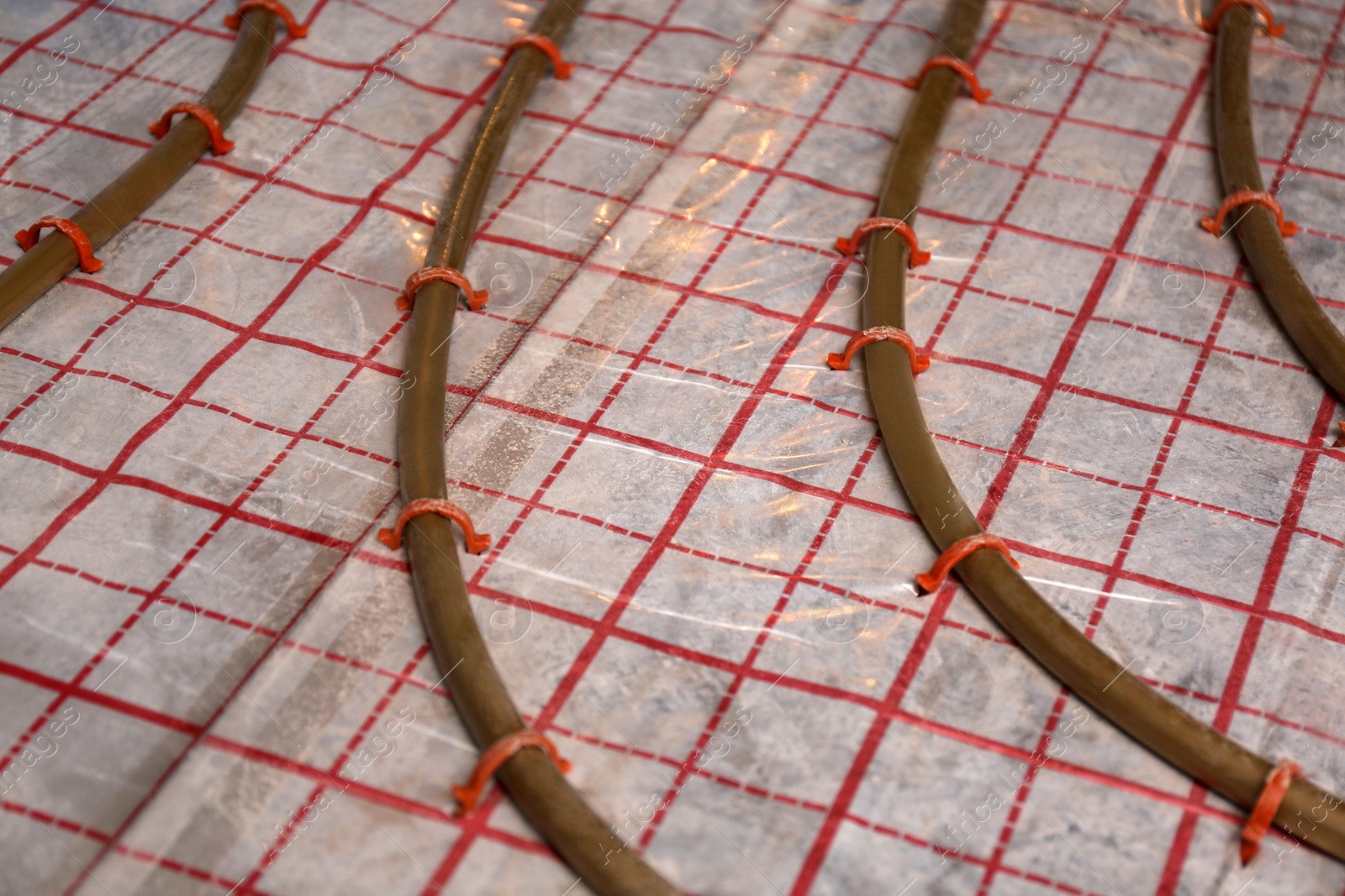 Photo of Installation of underfloor heating system in building