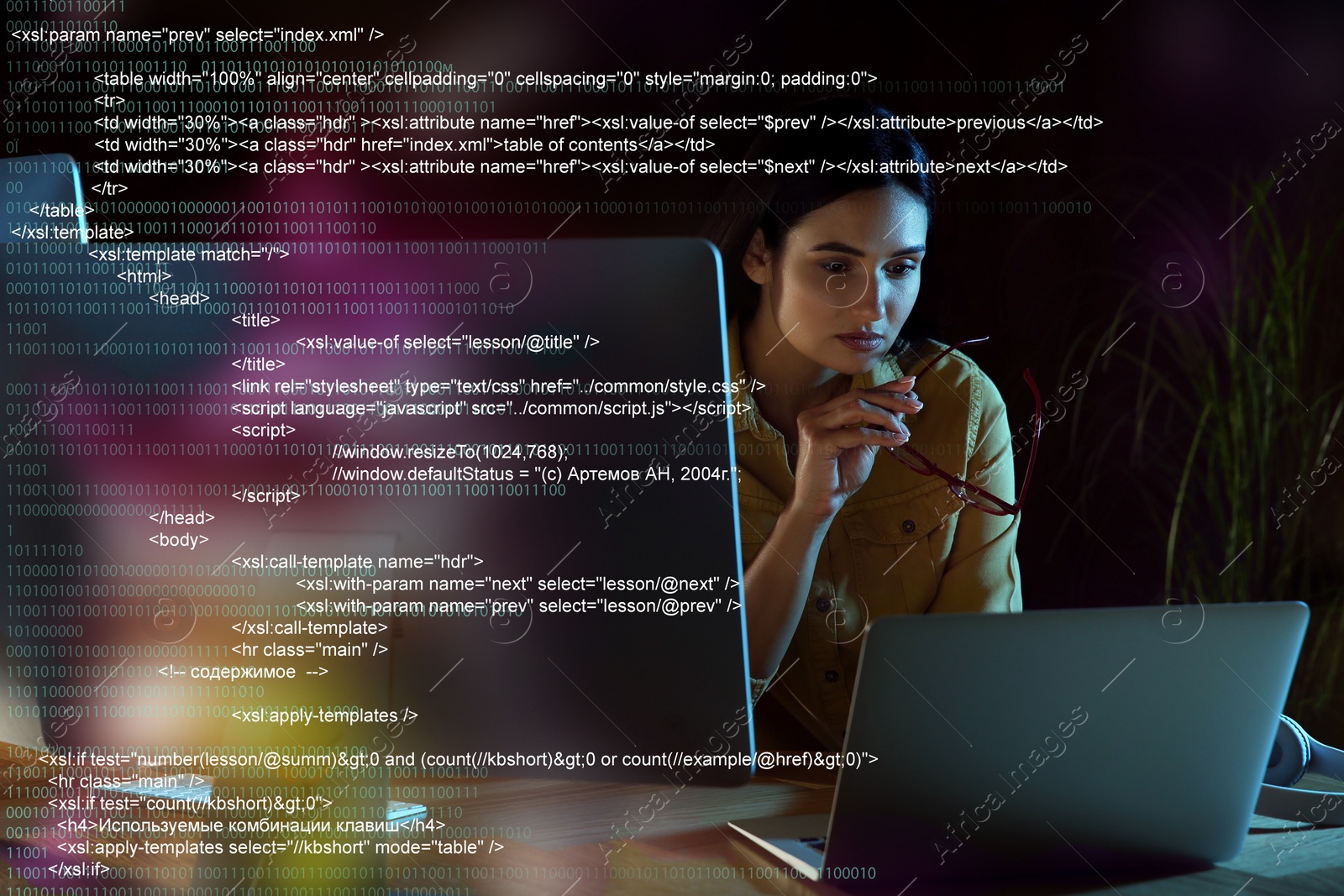 Image of Programmer working in modern office at night