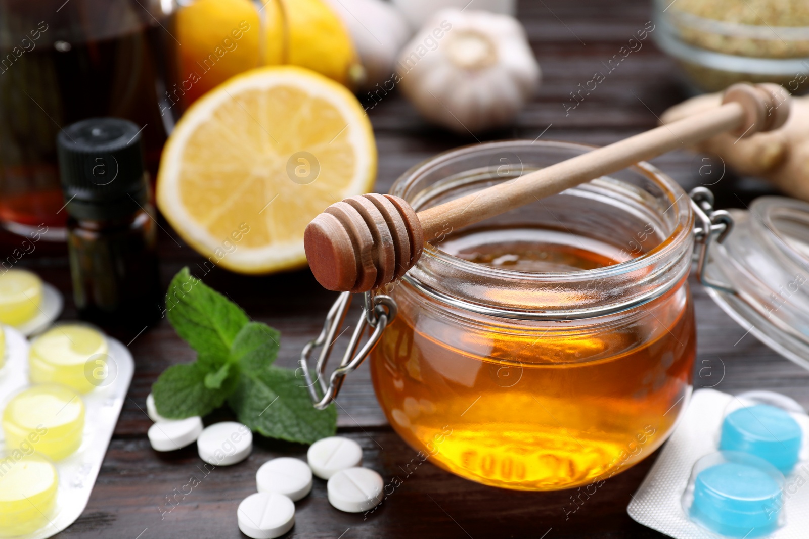 Photo of Different cold remedies on wooden table, closeup with space for text. Cough treatment