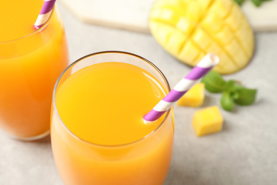 Photo of Fresh delicious mango drink on table, closeup