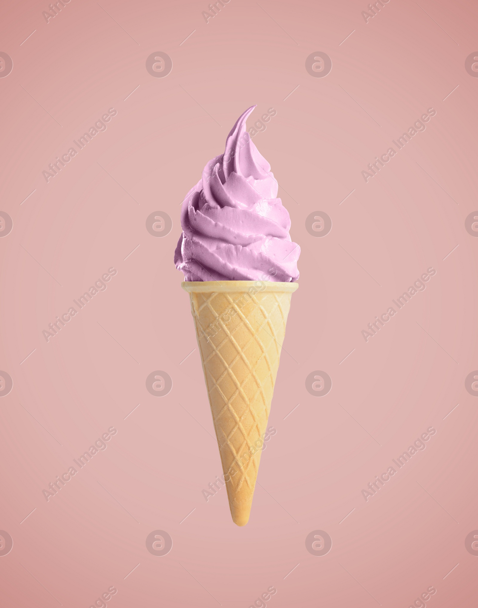 Image of Tasty berry ice cream in waffle cone on pastel coral background. Soft serve