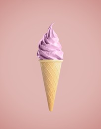 Tasty berry ice cream in waffle cone on pastel coral background. Soft serve