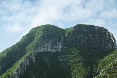 Photo of Picturesque landscape with high mountains under blue sky outdoors