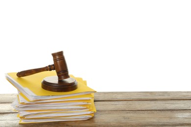 Stack of yellow files with documents and gavel on wooden table against white background. Space for text