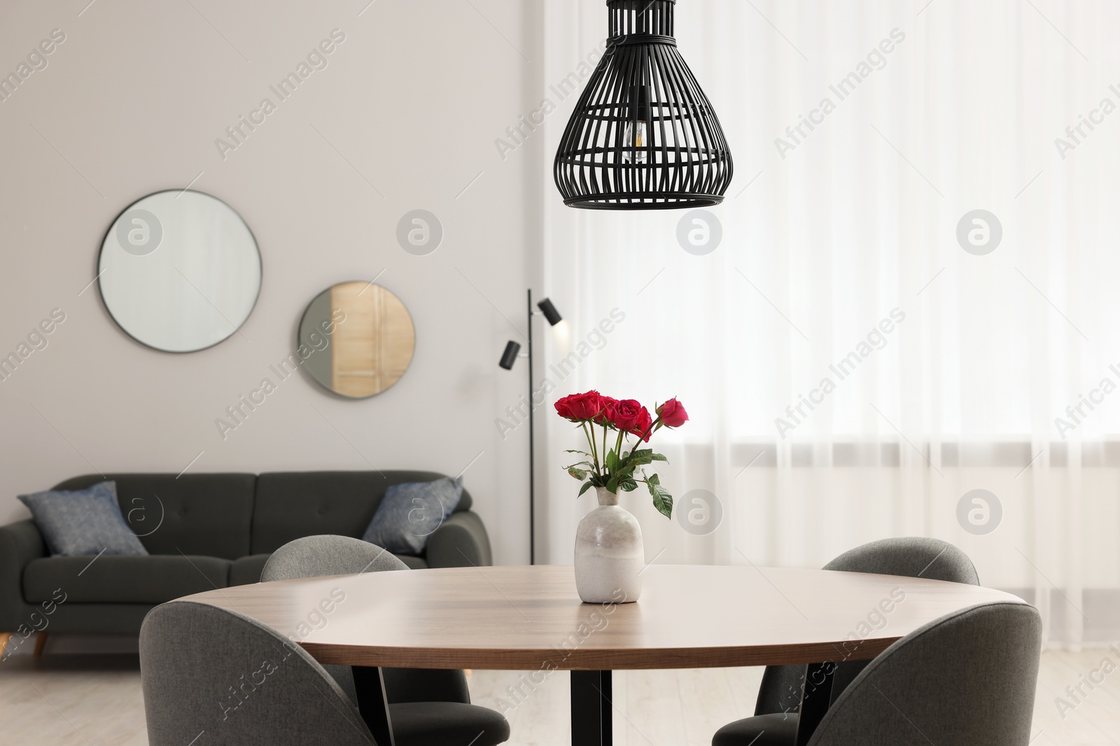 Photo of Stylish dining room interior with comfortable furniture