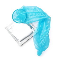 Image of Unrolled light blue condom and package on white background, top view. Safe sex