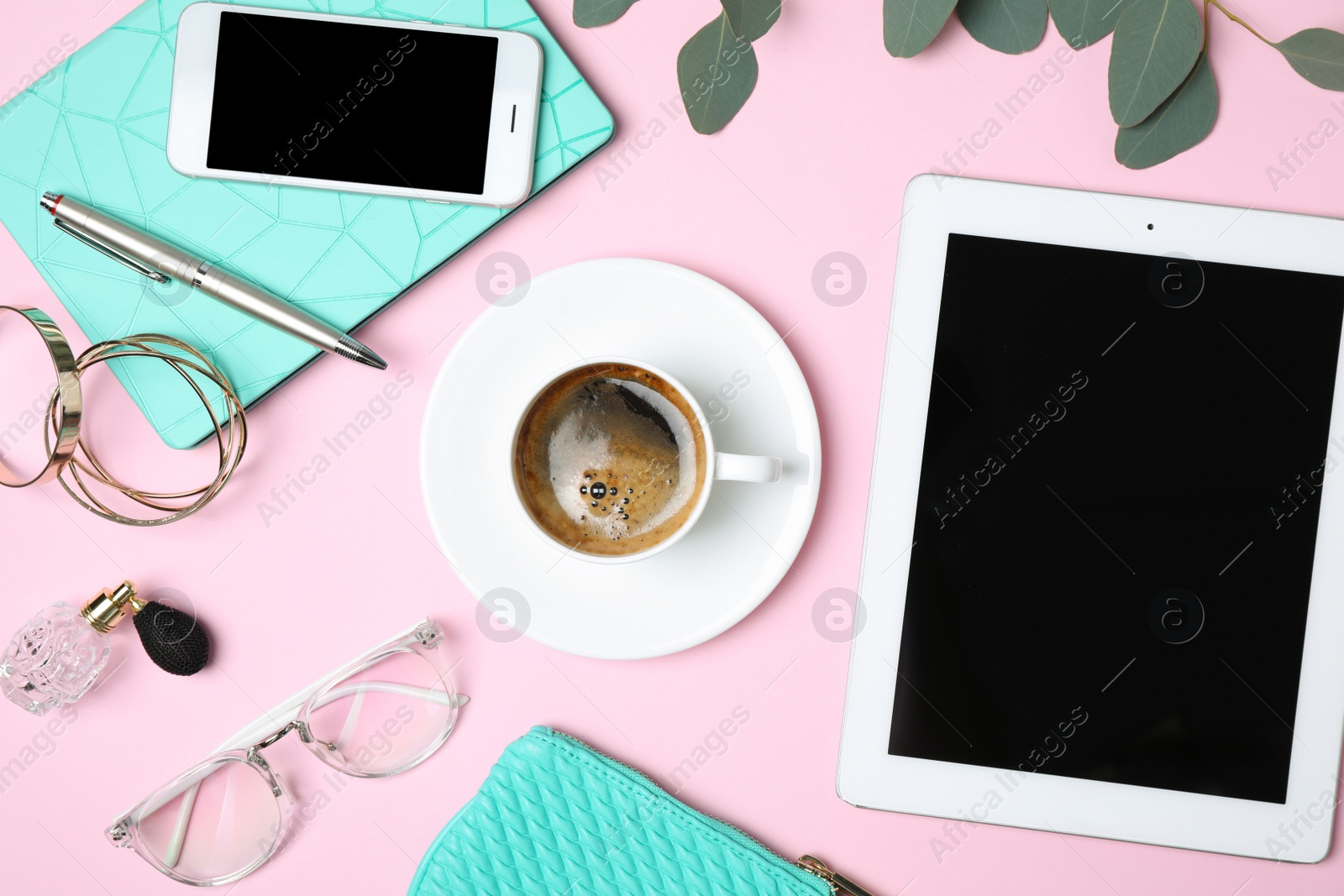 Photo of Flat lay composition with tablet, coffee and blogger's stuff on pink background