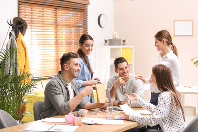 Photo of Team of professional journalists working in office