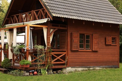 Exterior of beautiful wooden summer house with porch