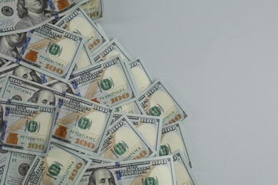Photo of Money exchange. Dollar banknotes on gray background, top view. Space for text