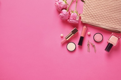 Photo of Flat lay composition with products for decorative makeup on pink background