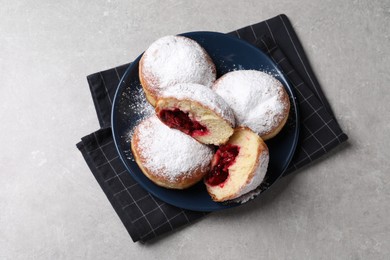 Delicious sweet buns with cherries on gray table, top view