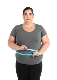 Overweight woman with measuring tape on white background