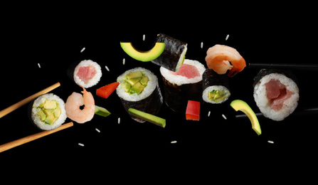 Image of Delicious sushi rolls and ingredients on black background