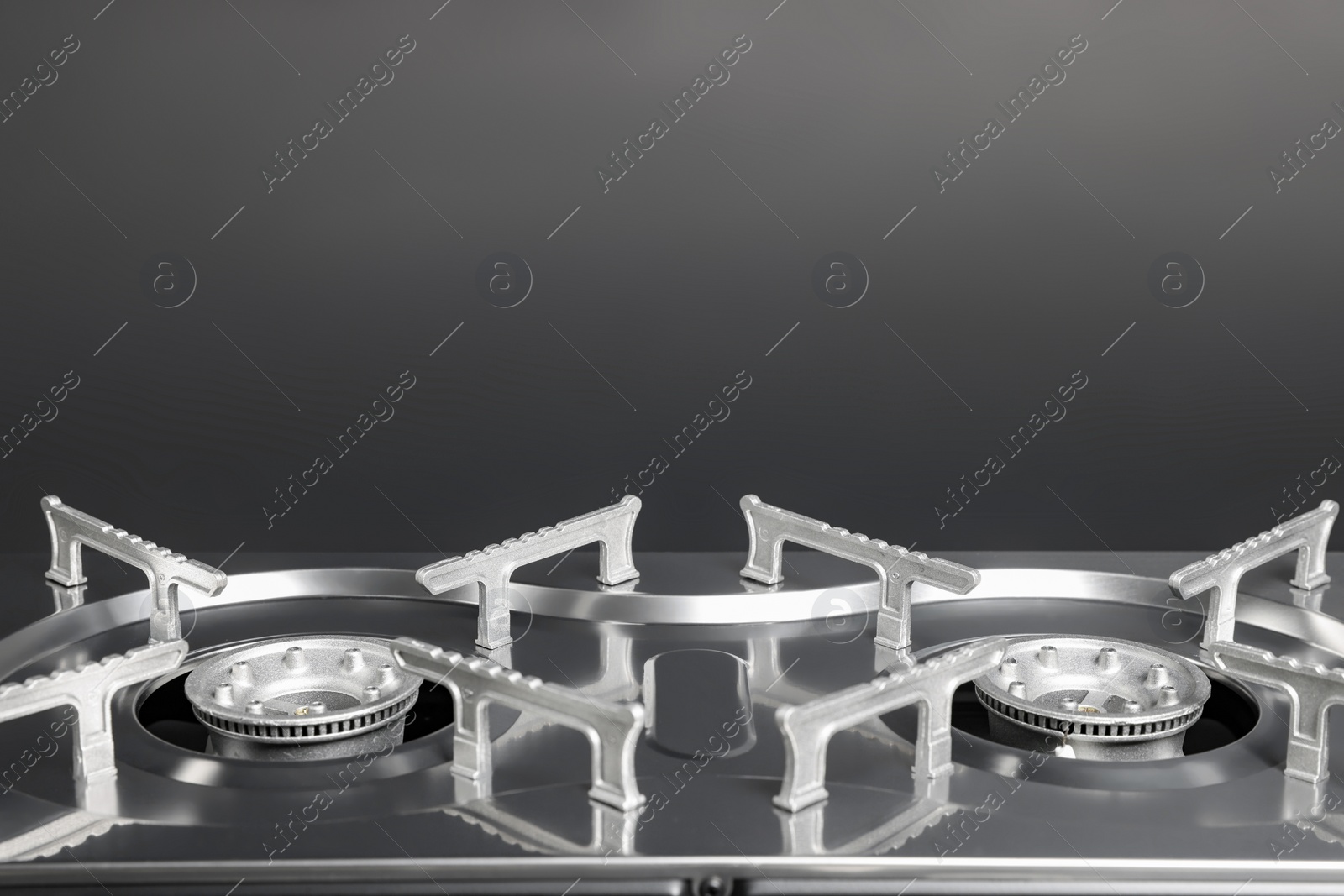 Photo of Portable gas stove on dark grey background, closeup with space for text. Military equipment